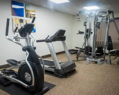 a gym with several exercise bikes in a room at Comfort Inn & Suites Caldwell in Caldwell