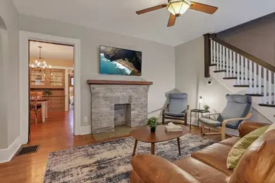 a living room with a couch and a fireplace at The Orchard Oasis in Columbus