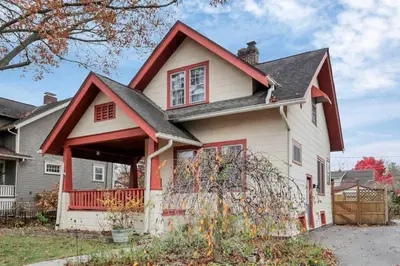a white house with a red roof at The Orchard Oasis in Columbus