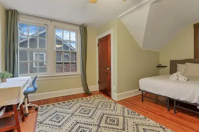 a bedroom with a bed and a window at The Orchard Oasis in Columbus