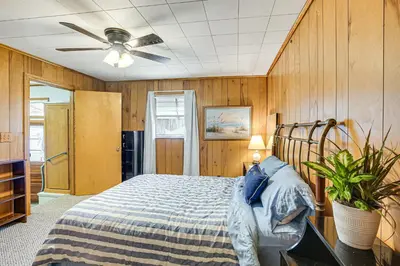 a bedroom with a bed and a ceiling fan at Stay and Play West Virginia Country Home! in Davisville
