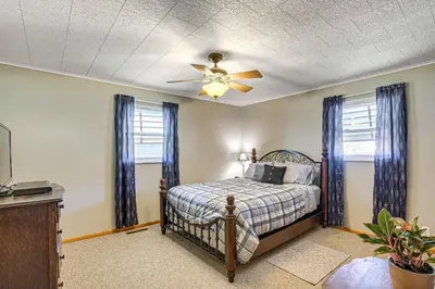 a bedroom with a bed and a ceiling fan at Stay and Play West Virginia Country Home! in Davisville