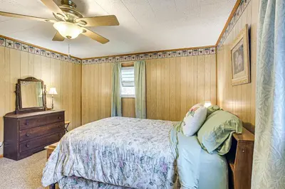 a bedroom with a bed and a ceiling fan at Stay and Play West Virginia Country Home! in Davisville
