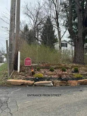 a garden with a chicken in the middle of the street at The House Hotels - Acadia Farms in Northfield