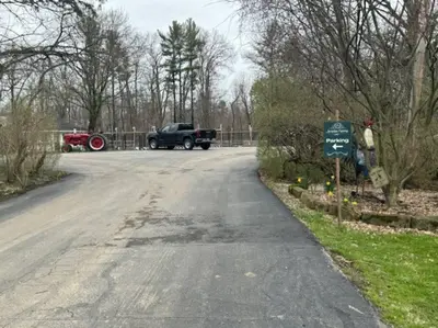 a truck parked on the side of a road at The House Hotels - Acadia Farms in Northfield