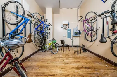 a room with several bikes hanging on the wall at Walk to Convention Center, Secured Apt in Columbus in Columbus