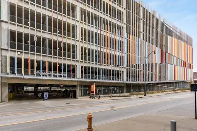 a large office building with a street in front of it at Walk to Convention Center, Secured Apt in Columbus in Columbus
