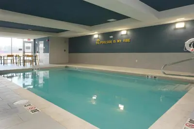a large swimming pool in a hotel room at Home2 Suites By Hilton Lima in Lima