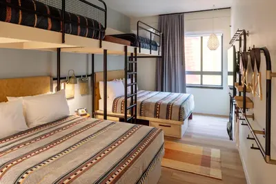 a bedroom with two bunk beds in a room at Moxy Cincinnati Downtown in Cincinnati