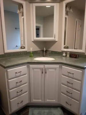 a white bathroom with a sink and a mirror at Large private retreat near Summit Lake in New Castle