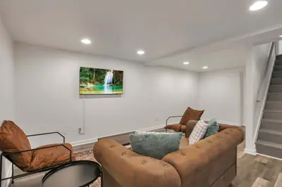 a living room with a couch and two chairs at The Gahanna Getaway in Gahanna