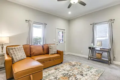 a living room with a couch and a table at 3 Mi to Dtwn Covington Getaway with Backyard in Covington