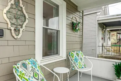 two chairs and a table on a porch at 3 Mi to Dtwn Covington Getaway with Backyard in Covington