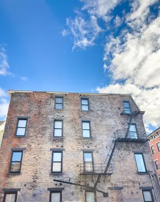 a tall brick building with a sky in the background at Modern & Cozy Downtown Apartment in Cincinnati in Cincinnati