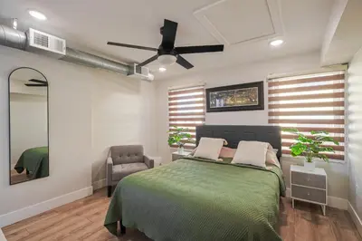 a bedroom with a bed and a ceiling fan at Modern & Cozy Downtown Apartment in Cincinnati in Cincinnati