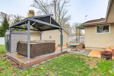 a gazebo with a hot tub in a yard at Walk to Sandusky Bay Home with Hot Tub and Fire Pit! in Sandusky