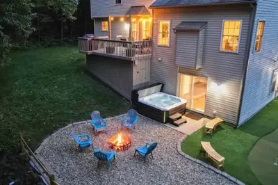 an image of a backyard with a fire pit and chairs at Weekend Retreat Hot Tub Game Room Putt Putt in Lancaster