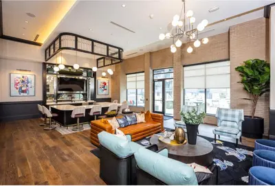 a living room with a couch and a table at Cozy 6BR 6BA combined Apartments Near Downtown Cincinnati in Cincinnati