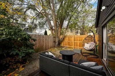 a patio with a couch and a table and a chair at Lux Ohio City Gem in Cleveland
