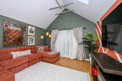 a living room with a couch and a window at Lux Ohio City Gem in Cleveland