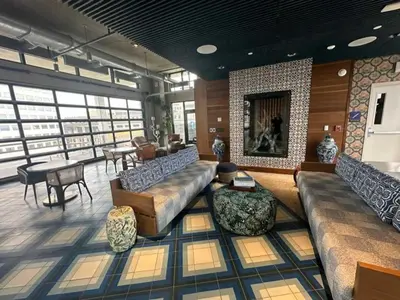 a large living room with a couch and a table at Brand new 2BR 3BA combined apartments with city views in Cleveland