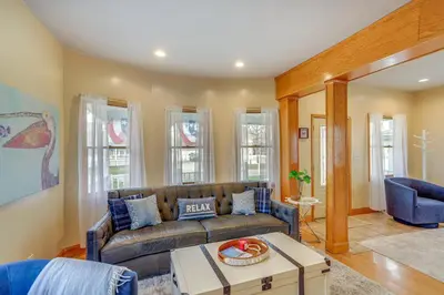 a living room with a couch and a table at Walk to Beach Home with Pool in Vermilion in Vermilion