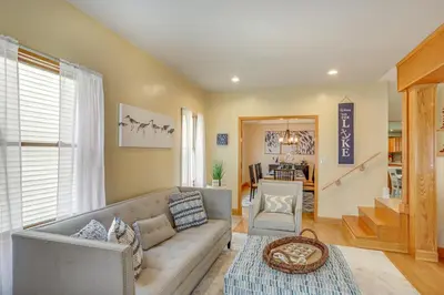 a living room with a couch and a chair at Walk to Beach Home with Pool in Vermilion in Vermilion