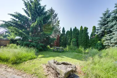 a park with a picnic table in the grass at Walk to Beach Home with Pool in Vermilion in Vermilion