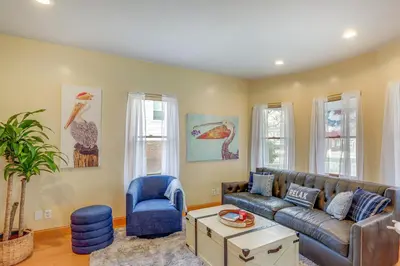 a living room with a couch and a chair at Walk to Beach Home with Pool in Vermilion in Vermilion