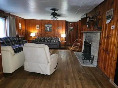 a living room with a couch and a fireplace at The White Stag in Hillsboro