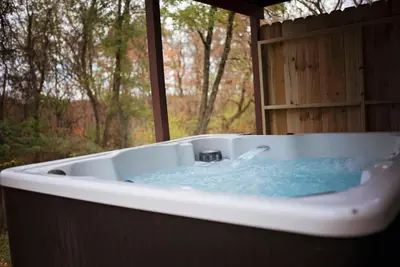 a bath tub with blue water in it at Adventure Hub Biking Hiking Hunting Paddle in Athens
