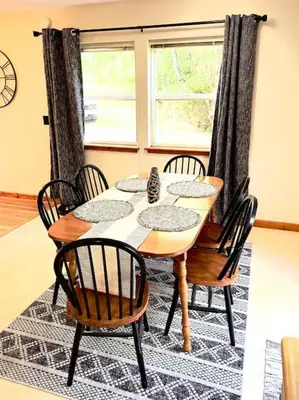 a dining room table with chairs and a window at Adventure Hub Biking Hiking Hunting Paddle in Athens