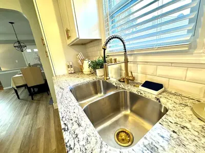 a kitchen sink in a kitchen with a window at Parma Ranch with Hot Tub and Game and Media Room in Parma