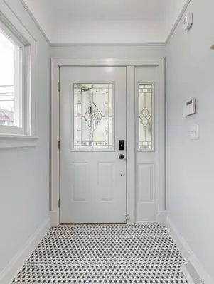 a white door with two windows in a room at Upscale Historic Home near Downtown, Hall of Fame, Beach, Arenas in Cleveland