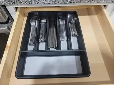 a set of forks and spoons in a drawer at Charming 4BR New Home Columbus With Garage Parking in Columbus