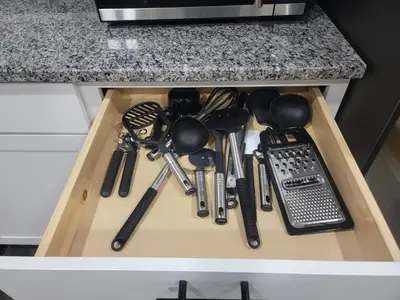a drawer filled with lots of kitchen utensils at Charming 4BR New Home Columbus With Garage Parking in Columbus