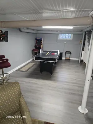 a room with a ping pong table in it at Leisure guest home in Lorain