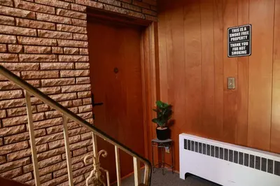 a brick building with a door and a potted plant at 30day Conveniently Located in a Quiet Suburb in Cincinnati