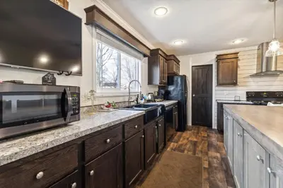 a kitchen with a microwave and a sink at Sunsets & Serenity- Port Clinton Waterfront Stay home in Port Clinton