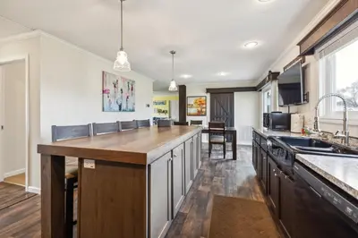 a kitchen with a large island in the middle at Sunsets & Serenity- Port Clinton Waterfront Stay home in Port Clinton