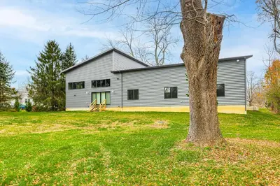 a house with a tree in front of it at 24 Mi to Cincinnati Newly Built Bethel Home! in Batavia