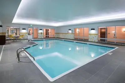 a large swimming pool in a hotel room at Fairfield Inn & Suites by Marriott Fort Wayne Southwest in Ellison