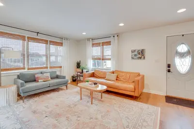 a living room with two couches and a table at Patio and Lake Views Family-Friendly Canton Retreat in Canton