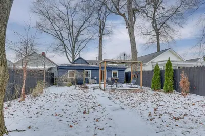 a house in the snow with a fence at Patio and Lake Views Family-Friendly Canton Retreat in Canton