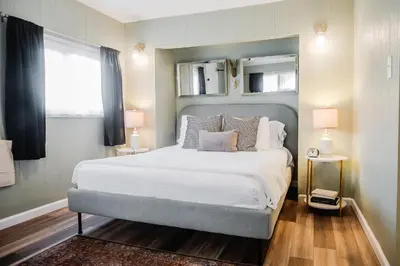 a bedroom with a large bed and a window at Tiny Home for a King in Dayton