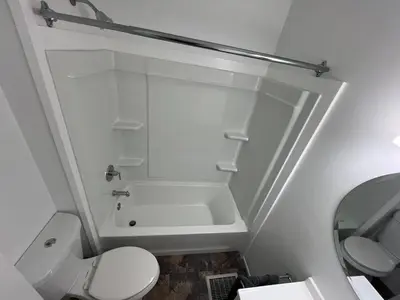 a bathroom with a shower and a toilet and a sink at Cozy at Anderson Towne Center in Cincinnati