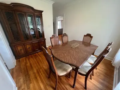 a dining room with a wooden table and chairs at Cozy at Anderson Towne Center in Cincinnati