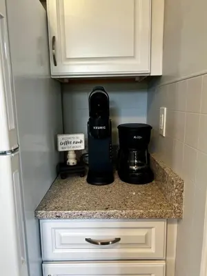 a kitchen counter with a coffee maker on it at Cozy at Anderson Towne Center in Cincinnati