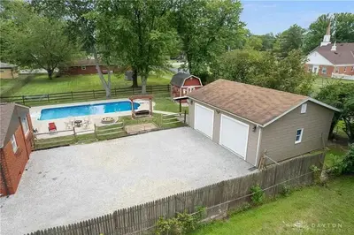 an overhead view of a backyard with a pool and a house at Just like home w Pool & Pool table in Milford