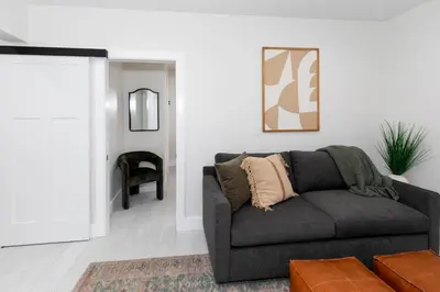 a living room with a couch and a table at Adjoining Condominium Units Sleeps 12 in Downtown Sandusky! in Sandusky